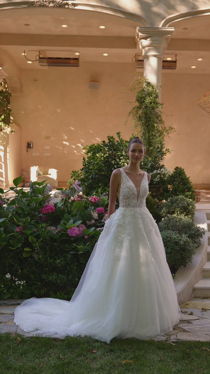 Deep V-neckline, thin straps & sheer side cut outs