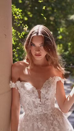 Off-the-shoulder illusion neckline with floral appliqué